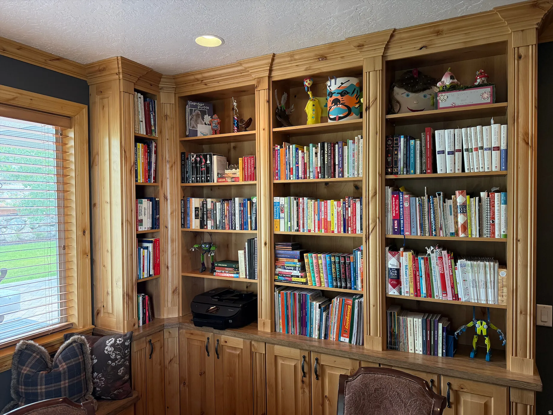 Details of custom built-in wood cabinetry with shelving and lower storage