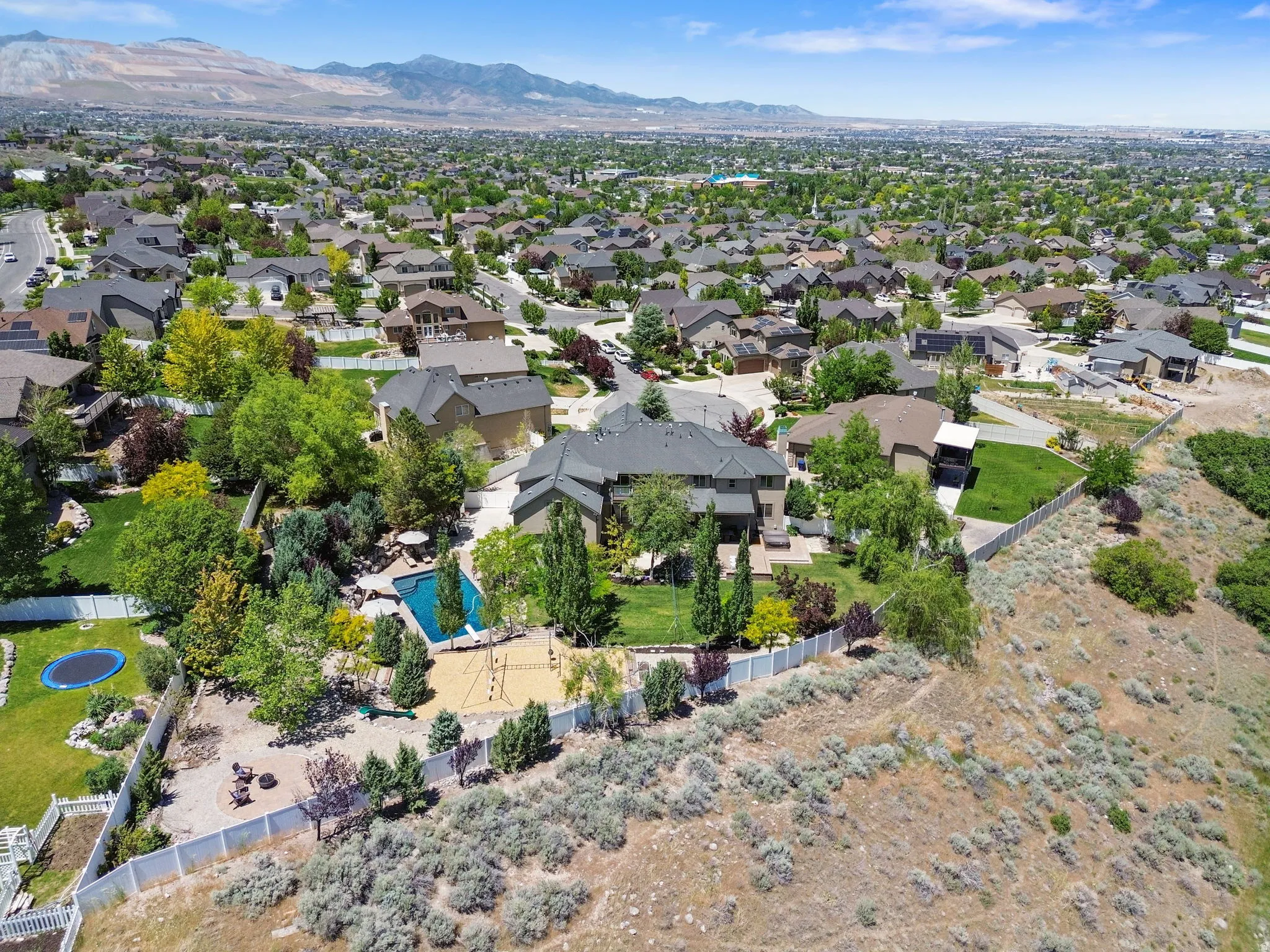 Drone shots of private lot including city land perfect for walking trails and limited neighbor intrusion.