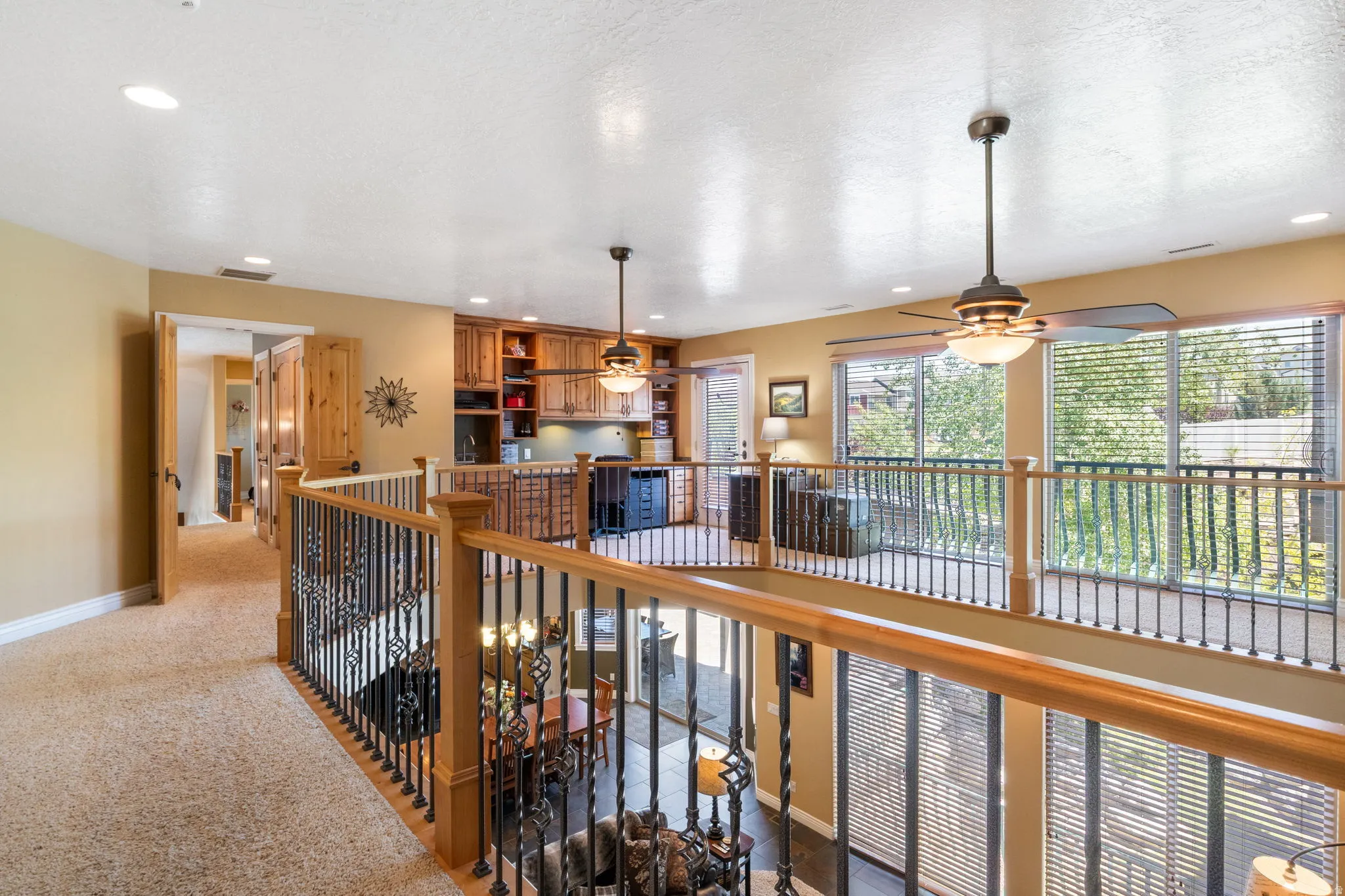 Upper-level cat walk to primary suite, loft family room and bedroom 4.