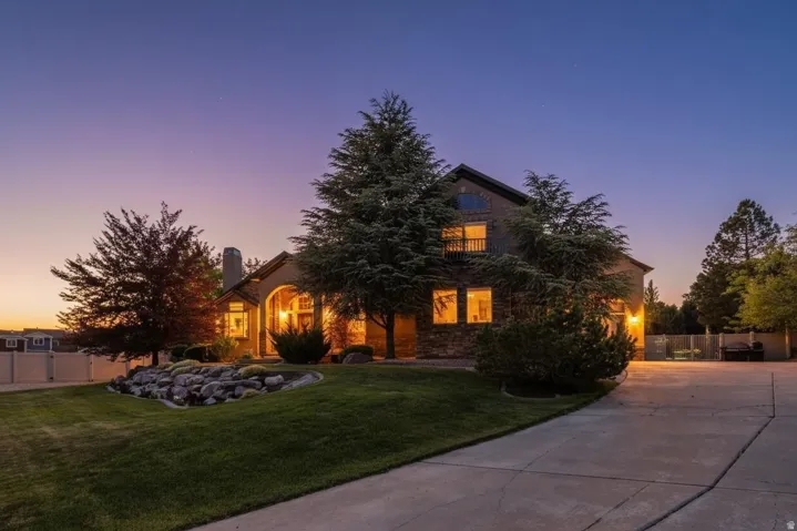 Welcome home! Stunning home perched on a hill, stone facade, long private driveway to a side load garage.