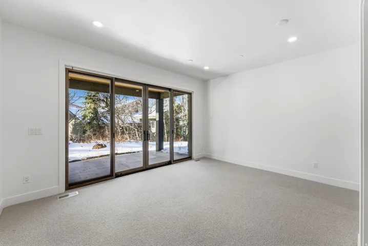 Bright interior space featuring a multi-panel sliding glass door system