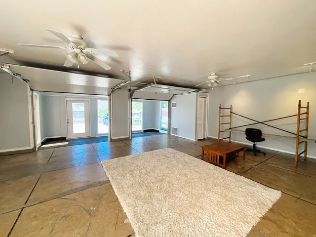 Spacious interior featuring stamped concrete flooring and a light color palette