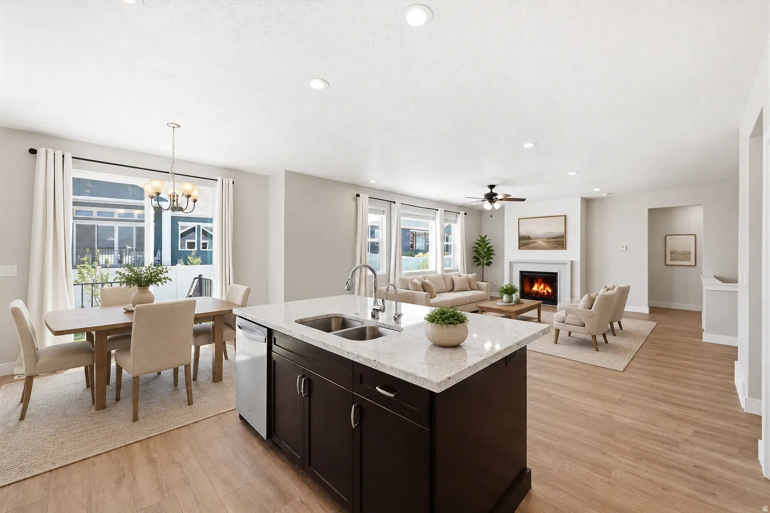 Open-concept living space featuring wood-finish flooring