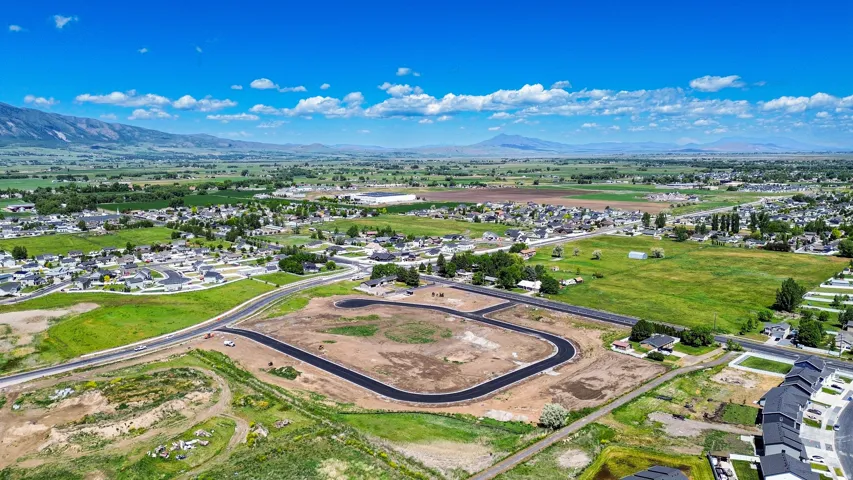 Developing residential area featuring newly paved roads and clear building lots