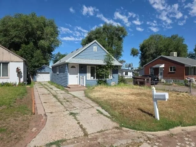 Light blue exterior with white trim and a front entry door