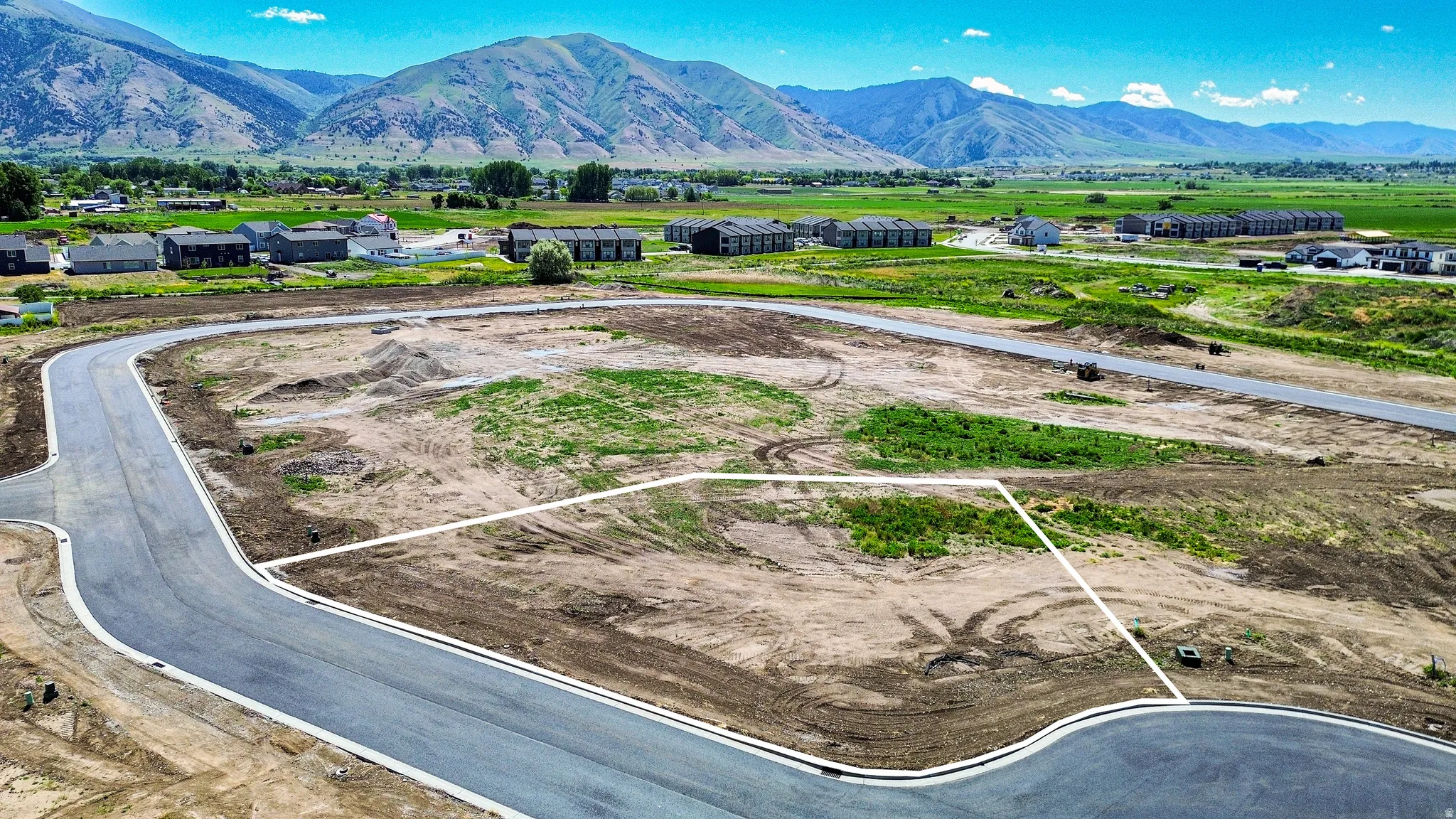 Expansive land parcel featuring defined lot lines and established roadways