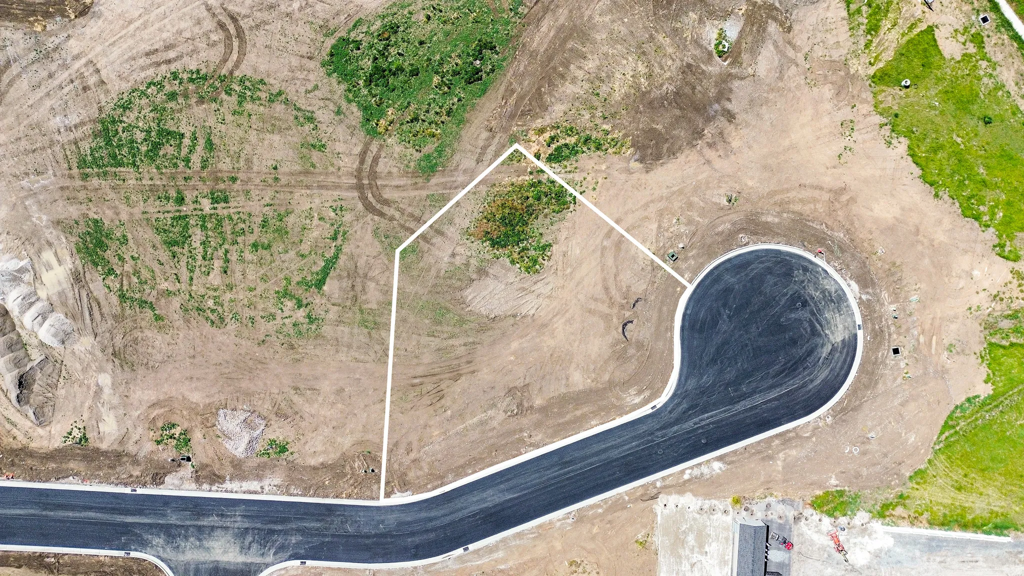 Vacant lot situated at the end of a newly paved cul-de-sac