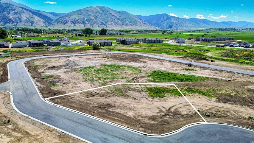 Expansive land parcel featuring defined lot lines and established roadways