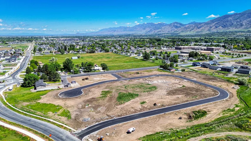 Developed land parcels featuring newly paved roads and clear mountain backdrops