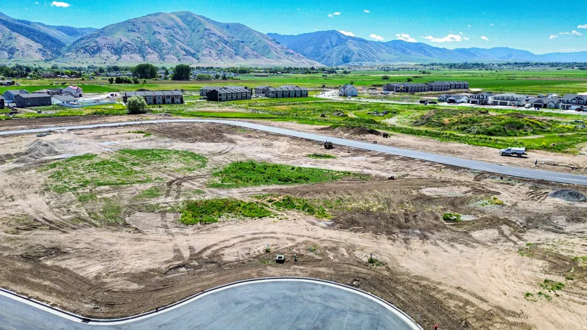 Expansive undeveloped lot featuring a newly paved roadway and cul-de-sac