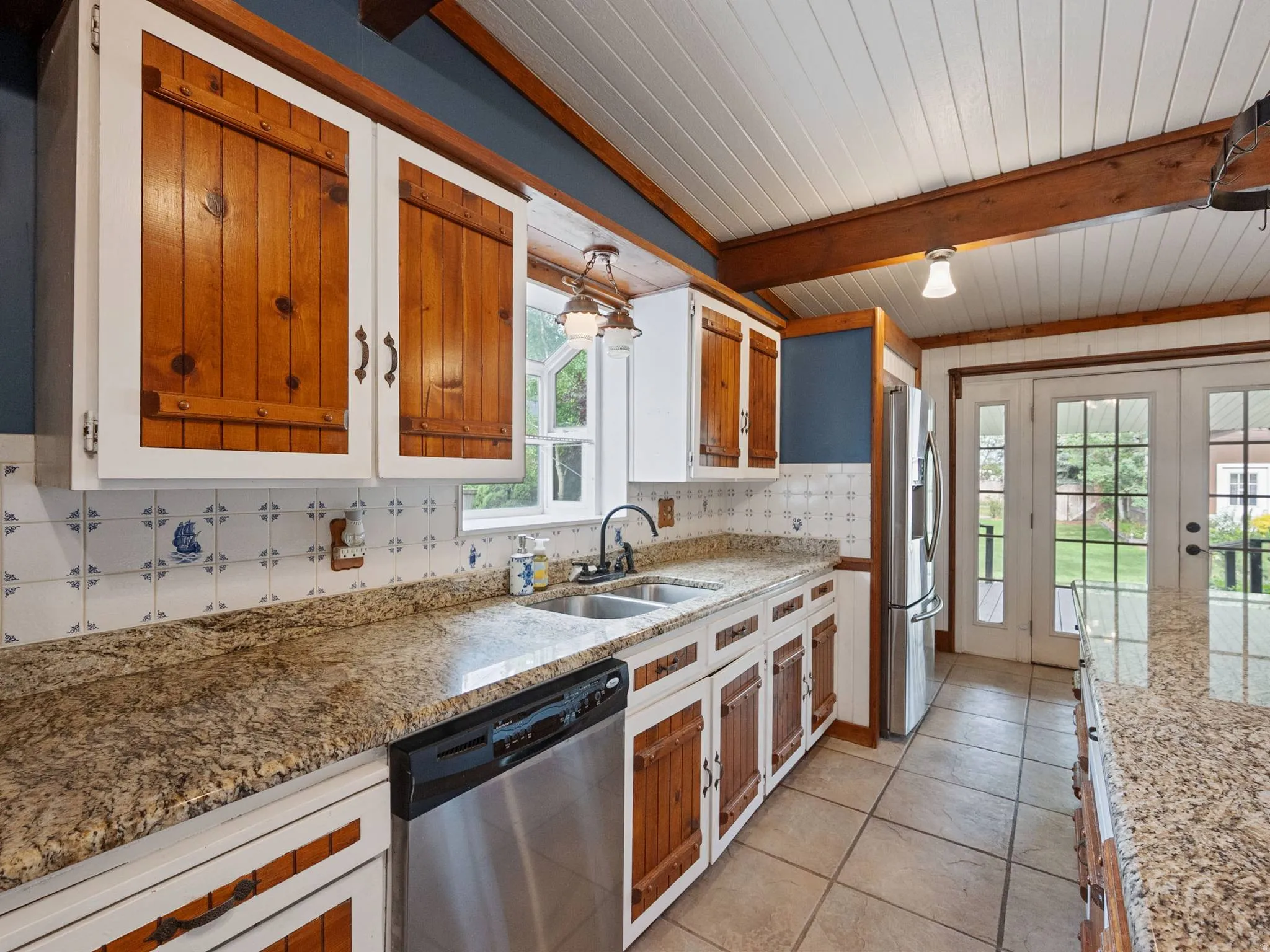 Another view of the kitchen with tile backsplash