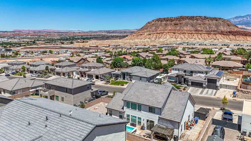 Aerial perspective showcasing a residential community with a prominent mountain backdrop