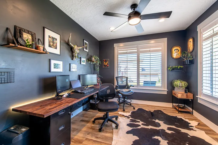 Dark-painted room featuring light wood-finish flooring