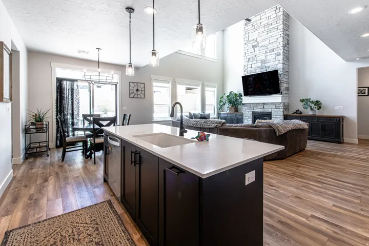 Open-concept living space with wood-finish flooring throughout
