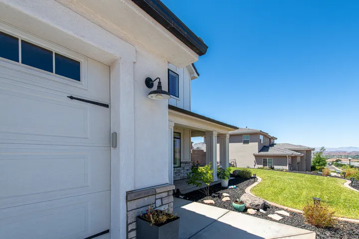 White stucco exterior with a stone accent facade