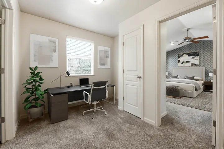 Versatile room featuring a window with blinds, neutral wall tones, and plush carpeting