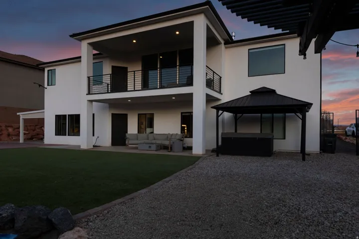 Modern two-story exterior with white stucco finish