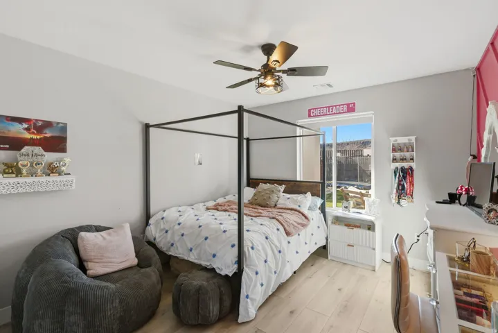 Light wood-finish flooring complements the neutral wall color in this room