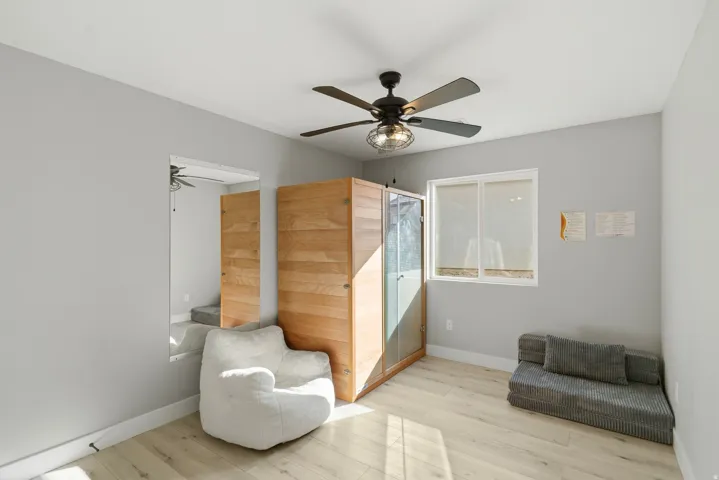 Light gray walls with wood-finish flooring