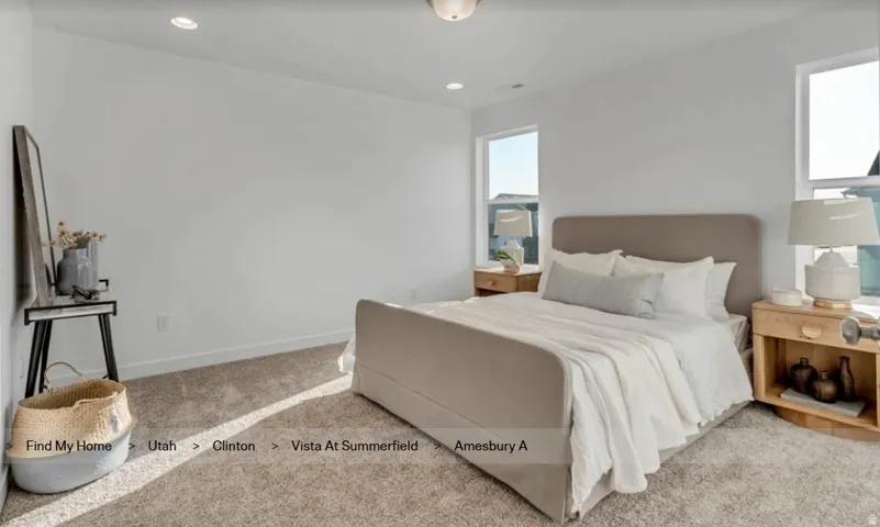 Carpeted room featuring white walls, recessed ceiling lighting, and two windows. This picture is of another home