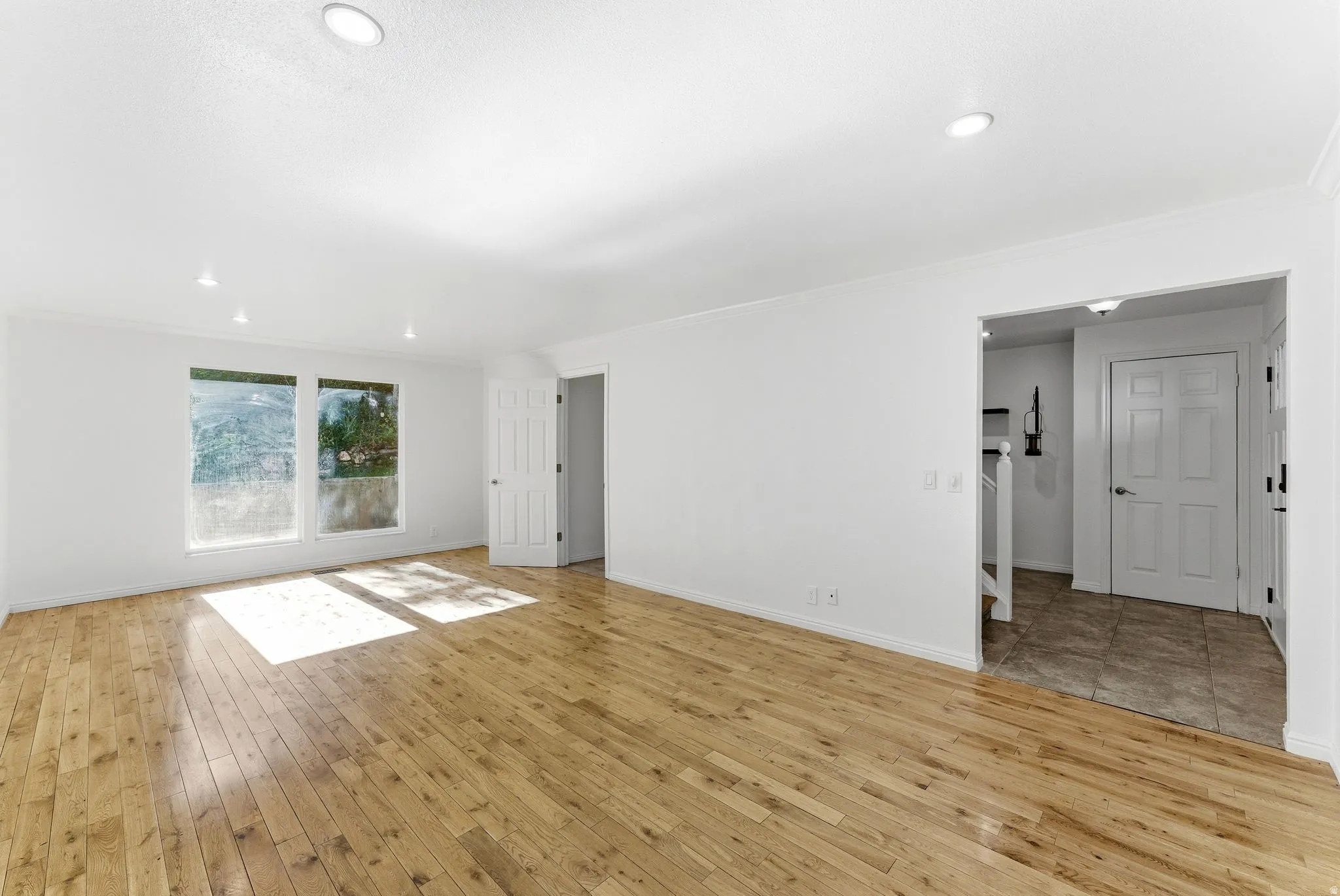 Spacious living room with hardwood floors