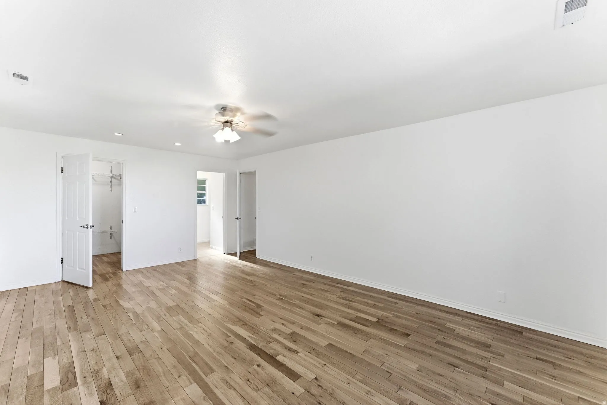Spacious primary suite with walk-in closet.