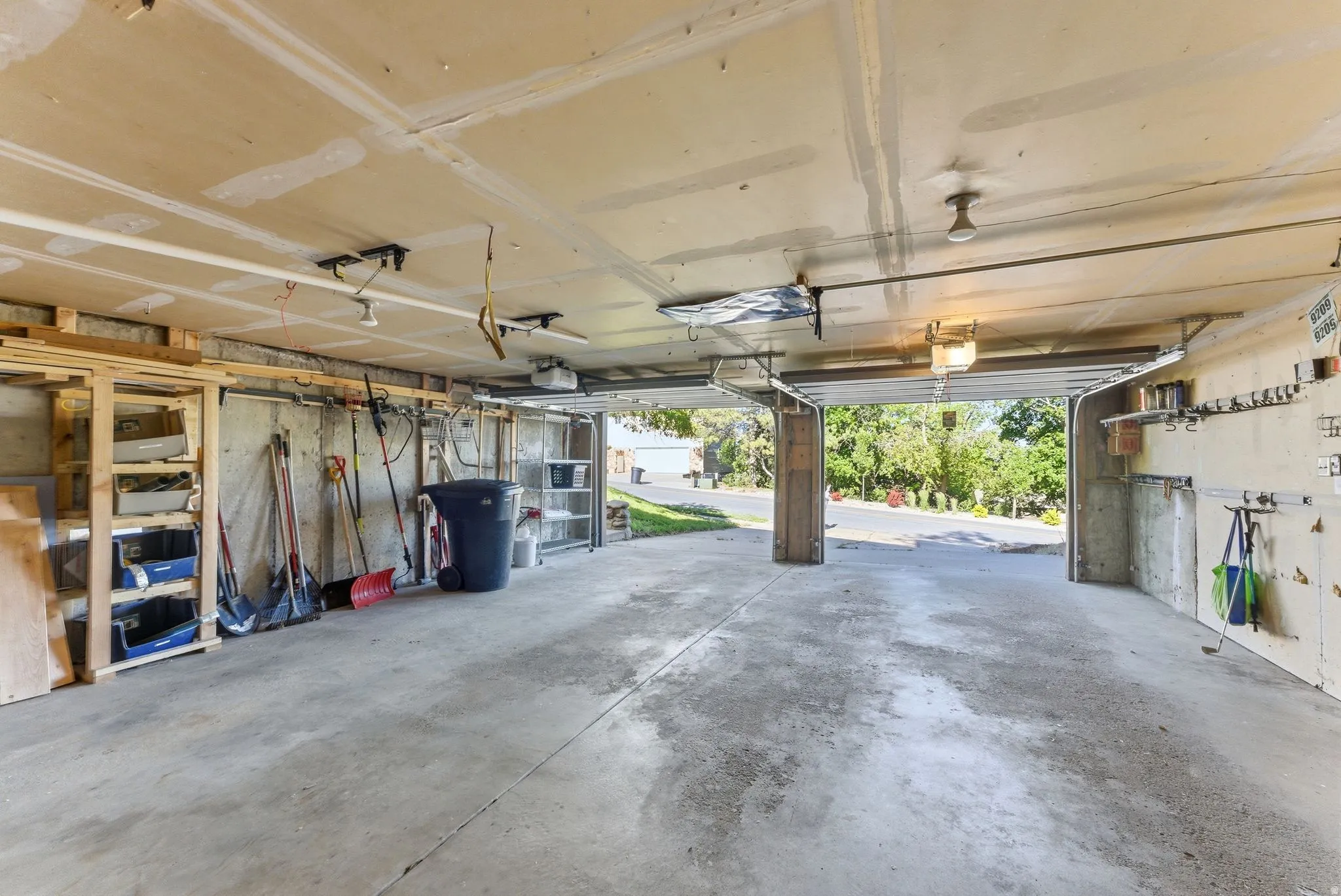 Concrete flooring in a spacious garage with exposed concrete walls