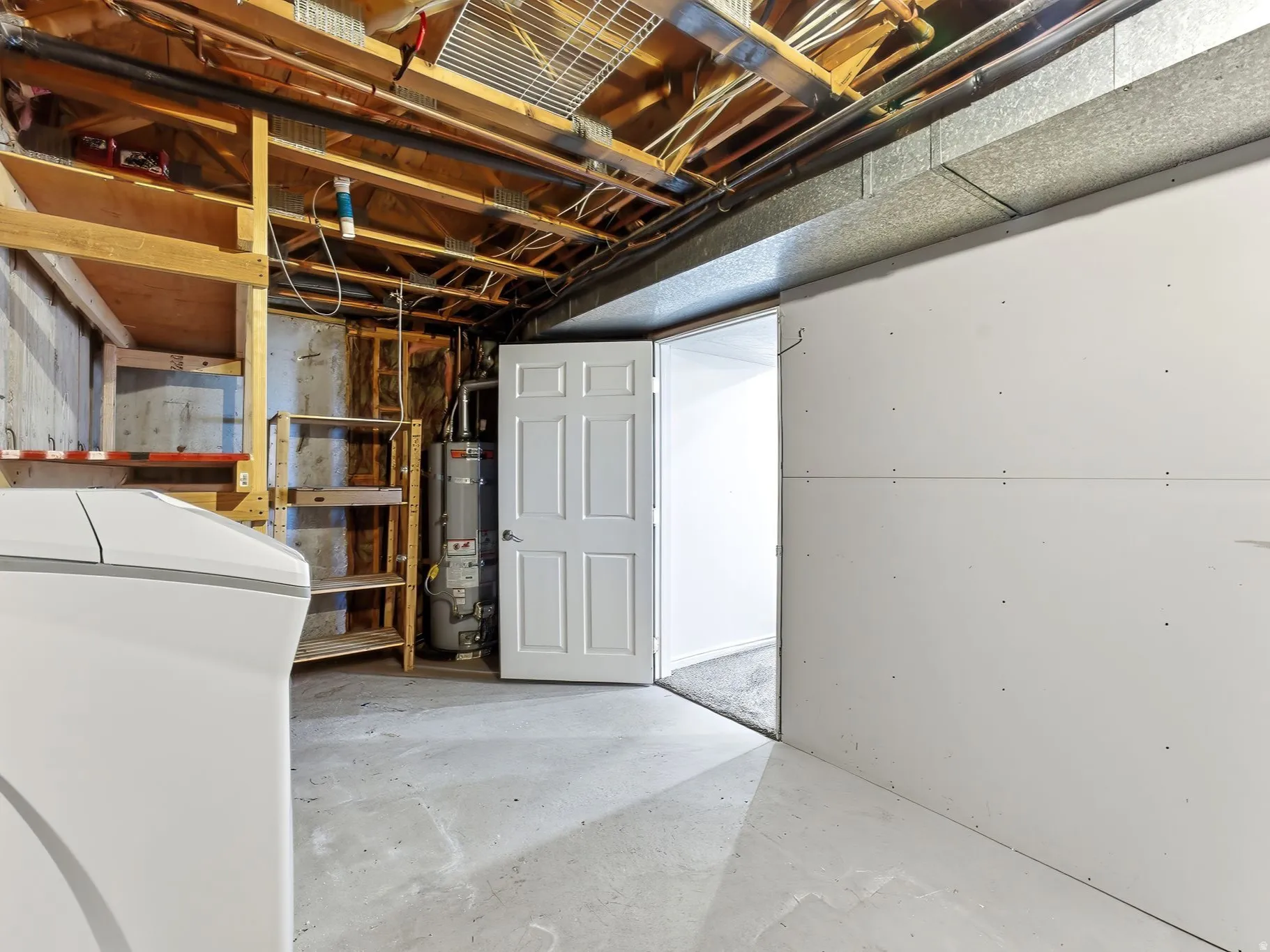 Utility space featuring built in shelves
