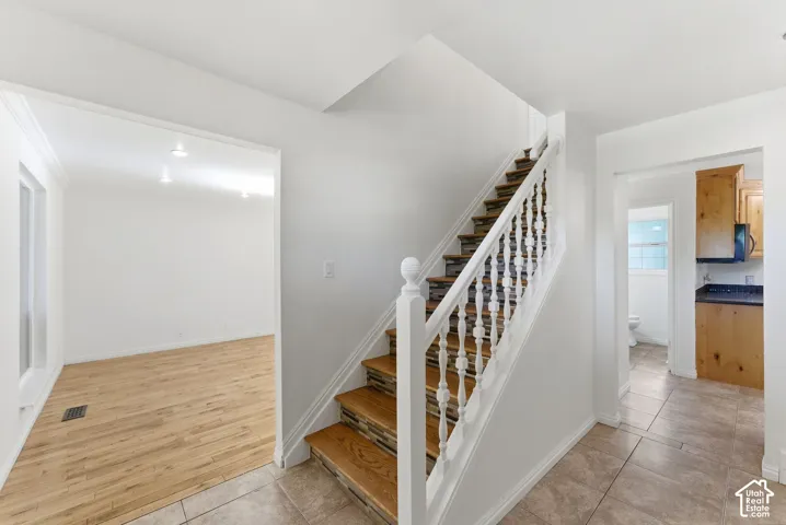 Entryway showing living room and kitchen access