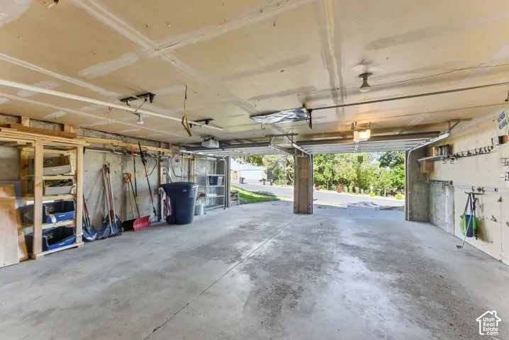 Concrete flooring in a spacious garage with exposed concrete walls