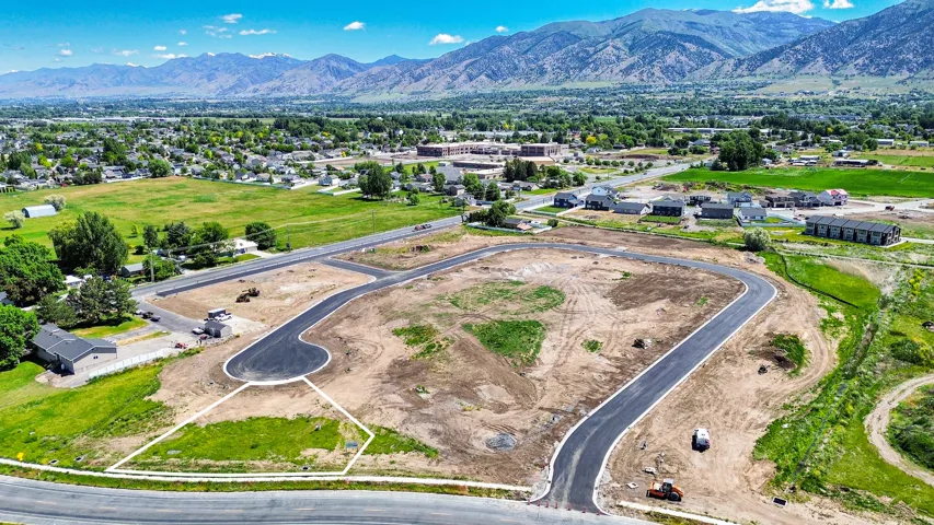 Developed land parcel featuring newly paved roadways and visible lot outlines