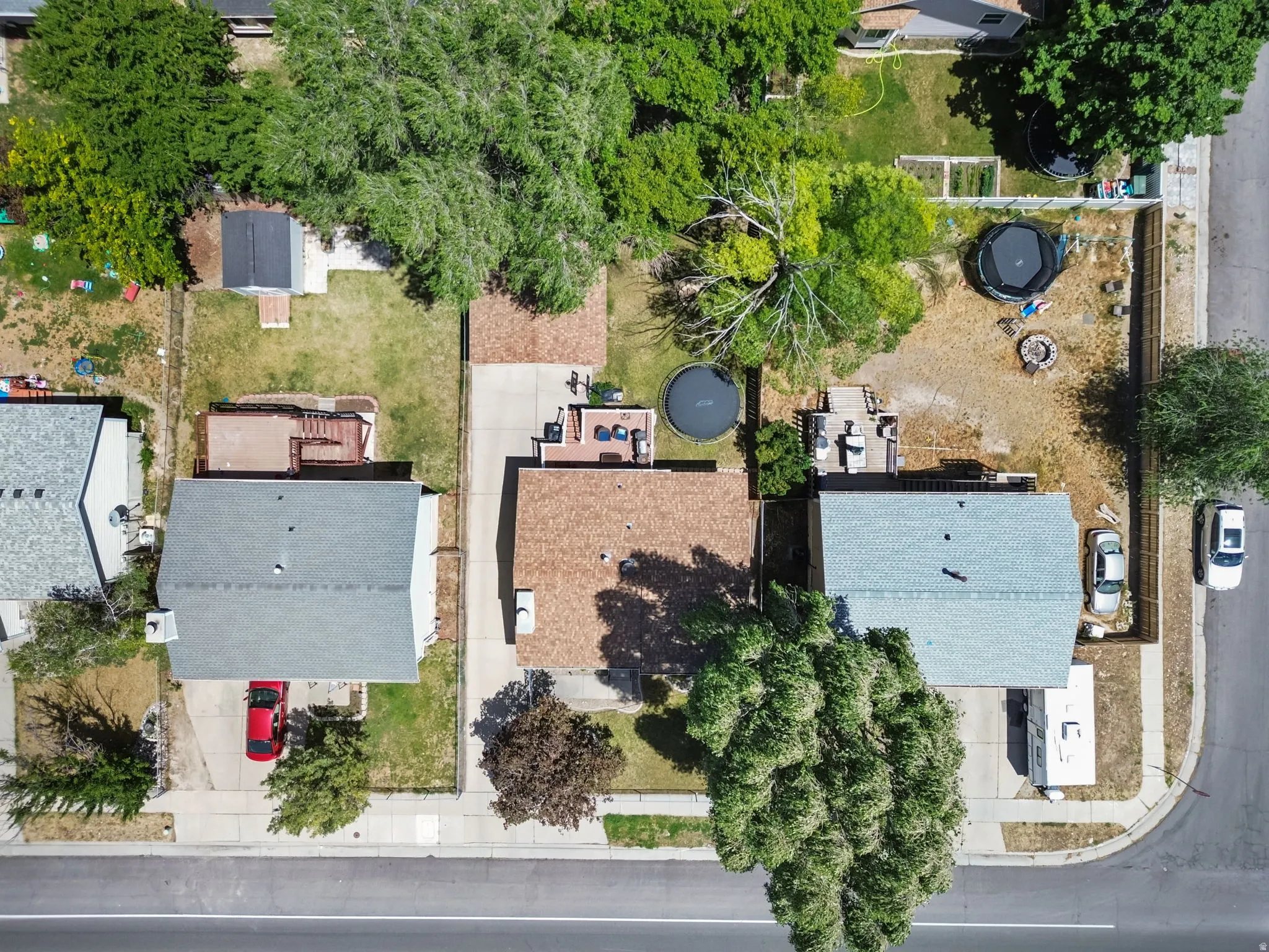 Aerial perspective showcasing multiple properties along a street