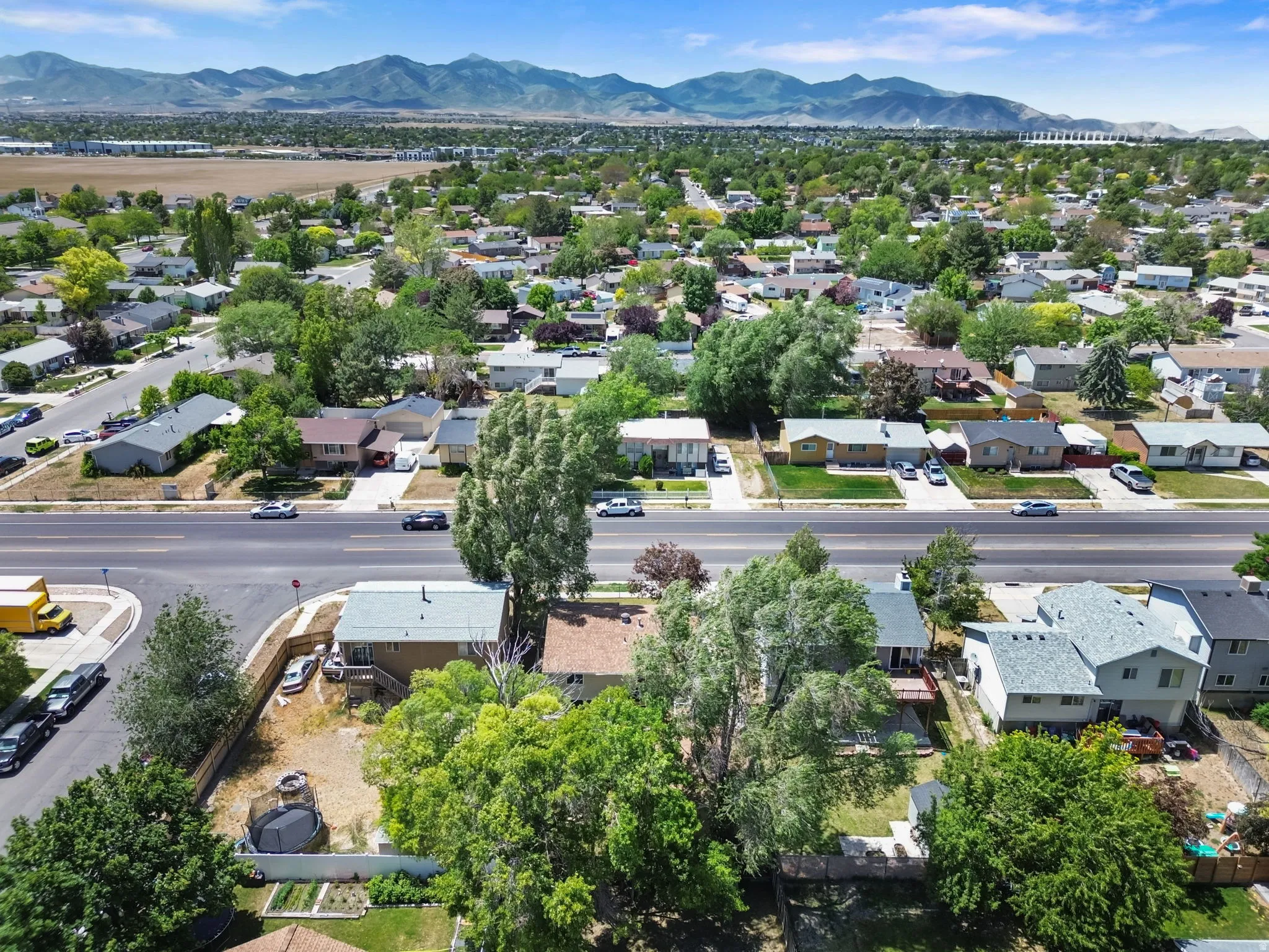 Residential neighborhood featuring diverse housing styles and mature landscaping