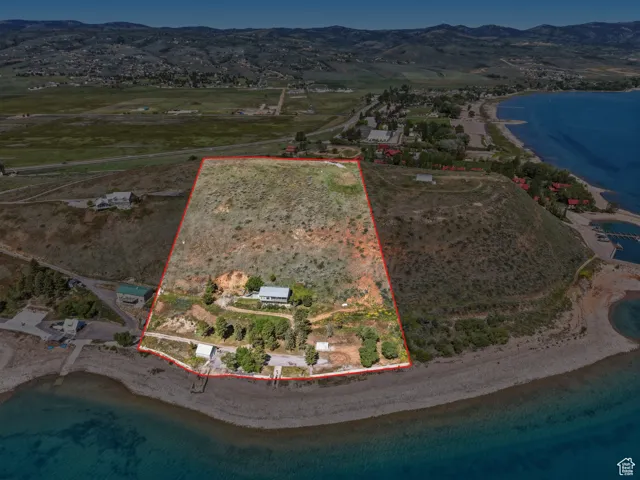Expansive lakefront property featuring a private beach and direct water access