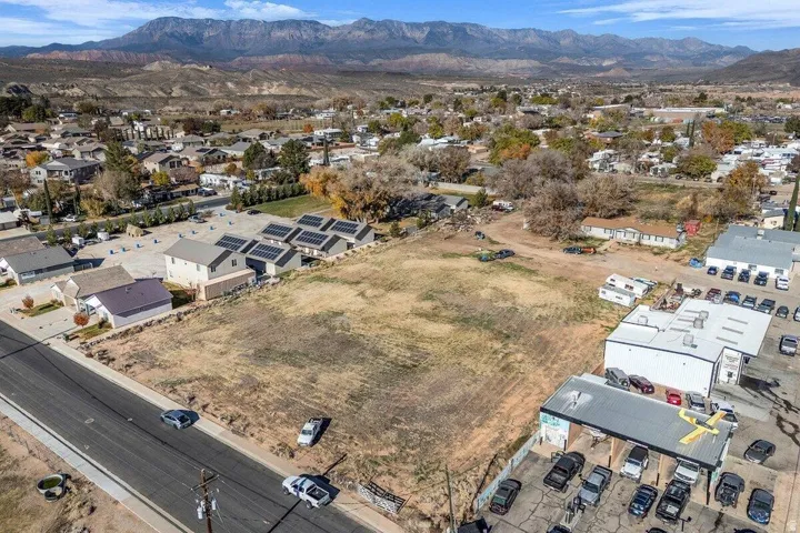 Expansive undeveloped land parcel featuring direct road frontage and mountain backdrop