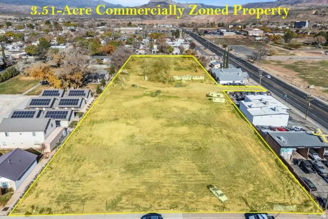 Expansive 3.51-acre commercially zoned property featuring open land with road frontage