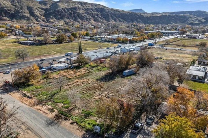 Expansive undeveloped lot featuring mature trees and street frontage