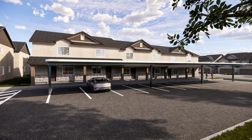 Multi-unit dwelling featuring a covered parking structure, stone veneer accents, and gabled rooflines