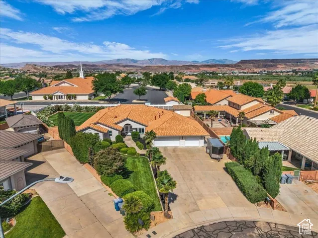 Expansive single-story residence with a stucco exterior and a terracotta tile roof