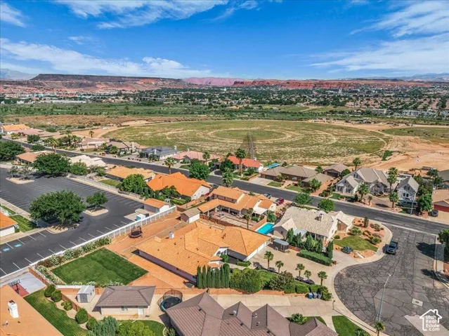 Aerial perspective showcasing a residential neighborhood with varied home styles and mature landscaping