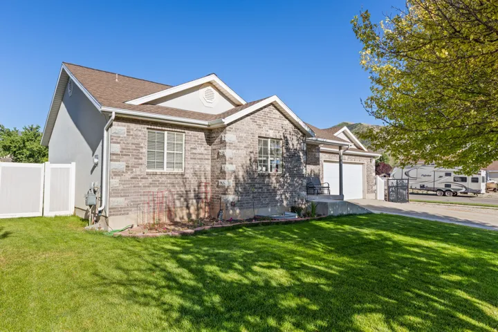 Brick and stucco exterior with a two-car garage