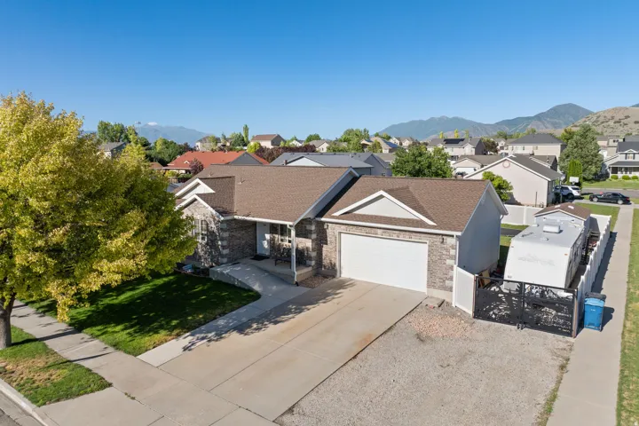 Ranch-style residence featuring a brick and siding exterior, an attached two-car garage, and a concrete driveway