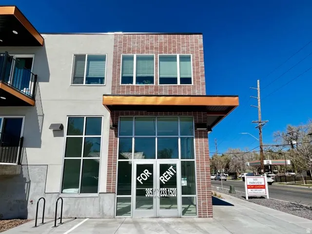 Contemporary mixed-material facade featuring brick and stucco finishes