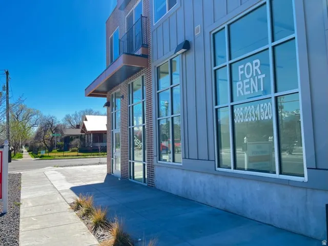 Contemporary building facade featuring brick and vertical siding