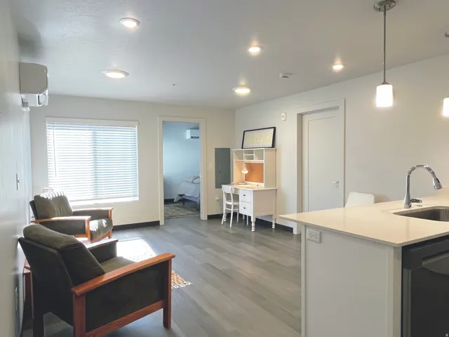 Open concept living area with wood-finish flooring