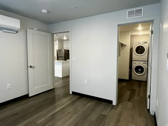 Contemporary interior featuring wood-finish flooring and light gray walls