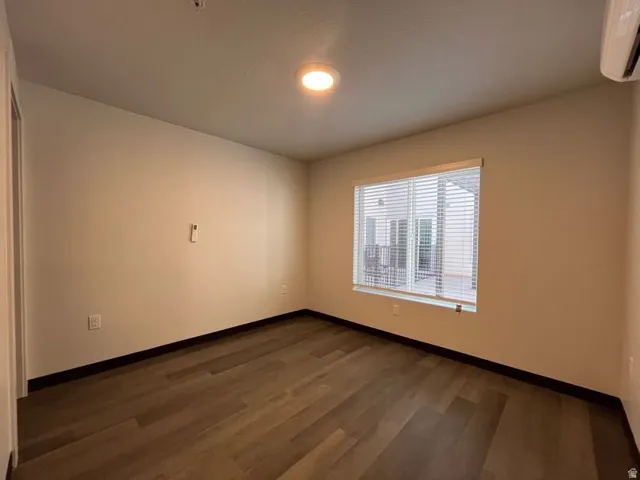 Recessed lighting illuminating wood-finish flooring