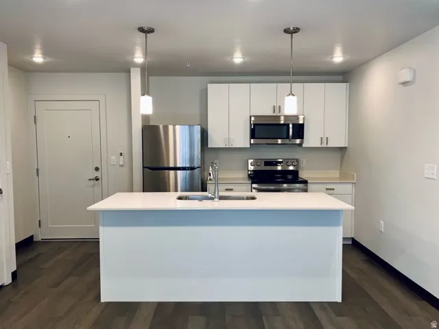Kitchen island with integrated sink and chrome faucet