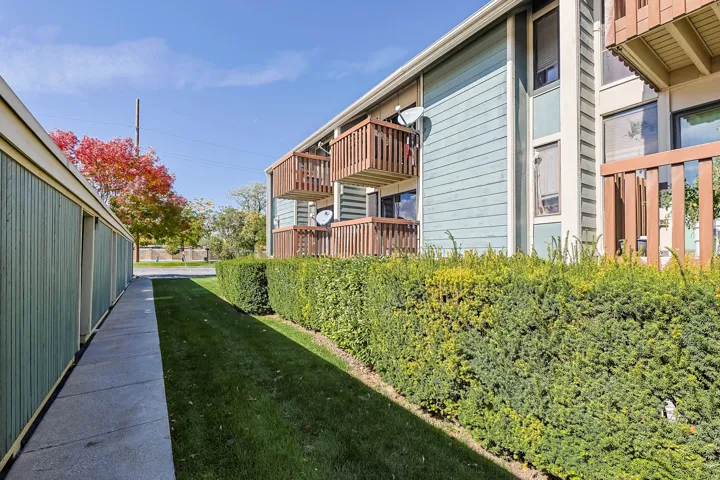 Building exterior featuring light blue siding with vertical accents