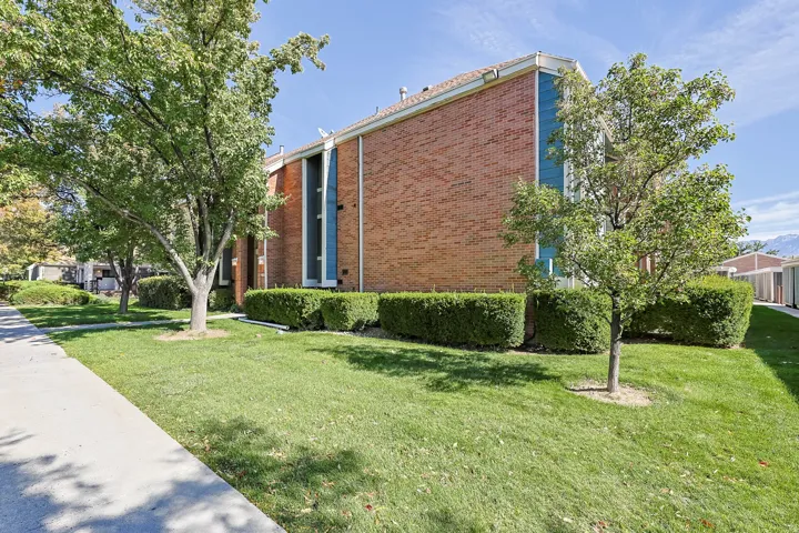 Brick exterior with contrasting blue vertical siding accents